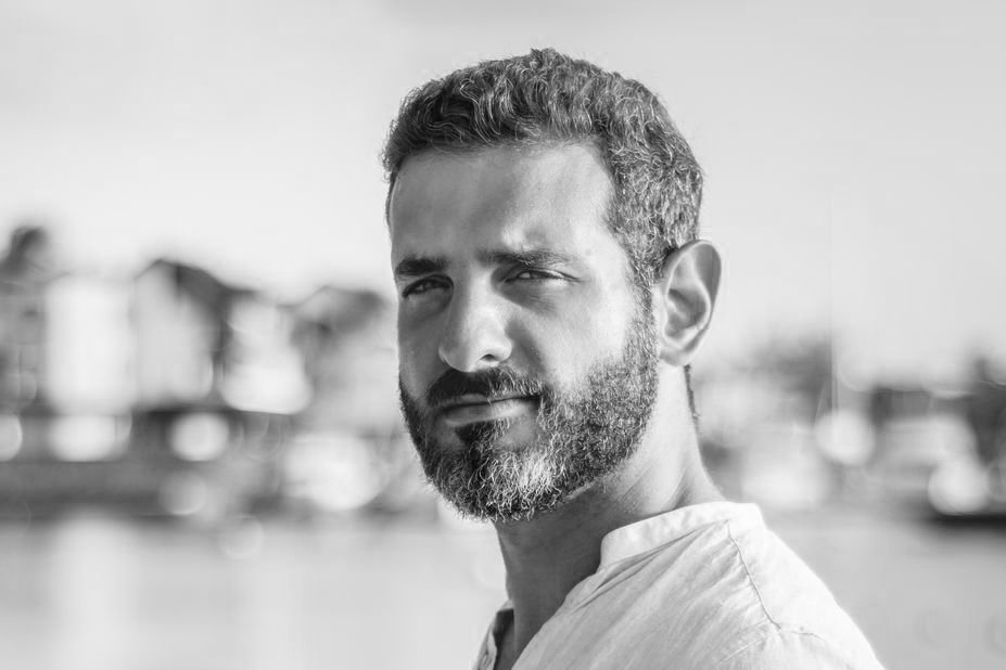 foggy mountains with sun setting behind them